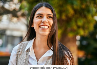 Young Hispanic Woman Smiling Happy Standing At The City.