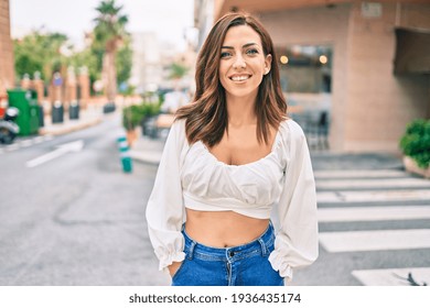 Young Hispanic Woman Smiling Happy Walking At The City.