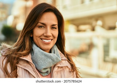 Young Hispanic Woman Smiling Happy Standing At The City.