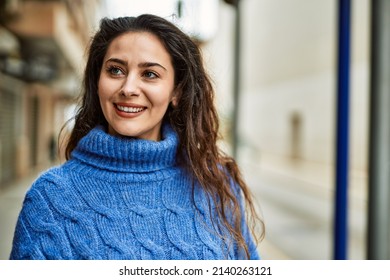 Young Hispanic Woman Smiling Happy Standing At The City.