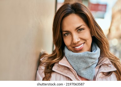 Young hispanic woman smiling happy standing at the city. - Shutterstock ID 2197063587