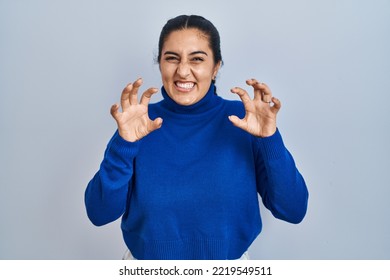 Young Hispanic Woman Standing Over Isolated Background Smiling Funny Doing Claw Gesture As Cat, Aggressive And Sexy Expression 