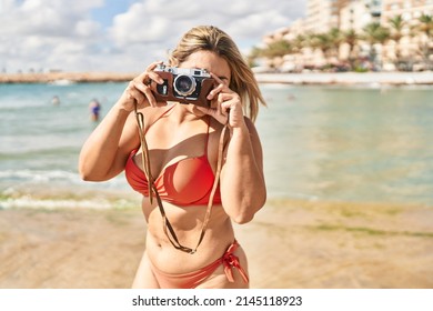 Young Hispanic Woman Wearing Bikini Make Photo At Seaside