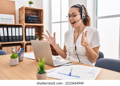 Young Hispanic Woman Wearing Call Center Agent Headset At The Office Celebrating Victory With Happy Smile And Winner Expression With Raised Hands 