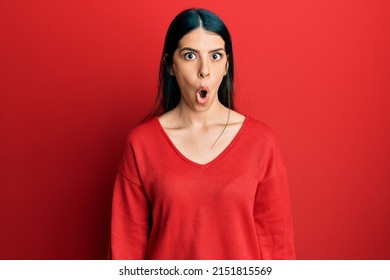 Young Hispanic Woman Wearing Casual Clothes Scared And Amazed With Open Mouth For Surprise, Disbelief Face 