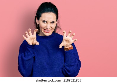 Young Hispanic Woman Wearing Casual Clothes Smiling Funny Doing Claw Gesture As Cat, Aggressive And Sexy Expression 