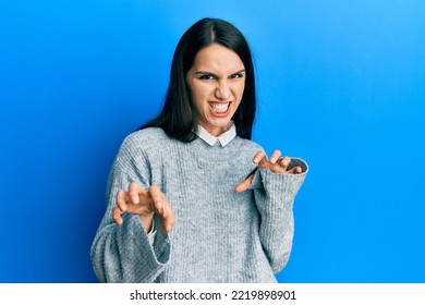 Young Hispanic Woman Wearing Casual Clothes Smiling Funny Doing Claw Gesture As Cat, Aggressive And Sexy Expression 