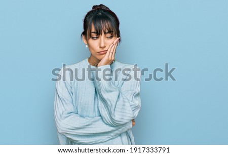 Young hispanic woman wearing casual clothes thinking looking tired and bored with depression problems with crossed arms. 