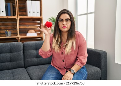 Young Hispanic Woman Working On Couple Therapy At Consultation Office Thinking Attitude And Sober Expression Looking Self Confident 