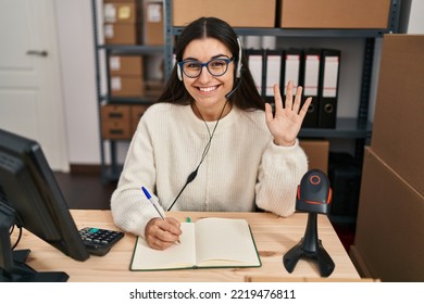 Young Hispanic Woman Working At Small Business Ecommerce Wearing Headset Looking Positive And Happy Standing And Smiling With A Confident Smile Showing Teeth 