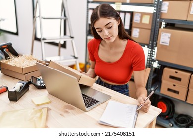 Young Hispanic Woman Working At Warehouse