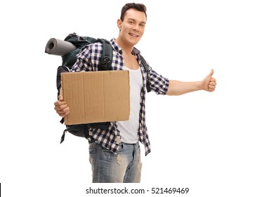 Young hitchhiker holding a blank cardboard sign isolated on white background
