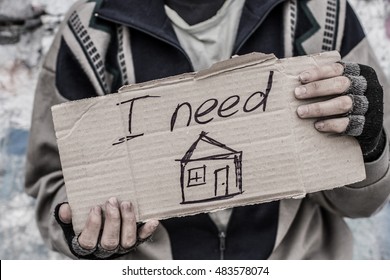 Young Homeless Man Holding Sign 