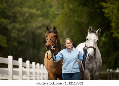 Young Horse Trainer Exercising Her Horses.