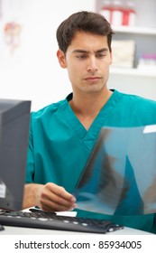 Young Hospital Doctor At Desk