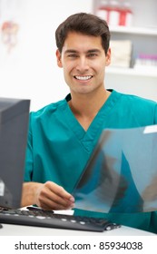 Young Hospital Doctor At Desk