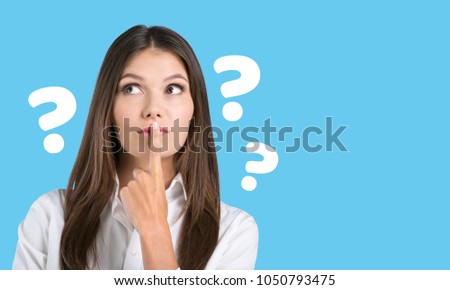 Young housewife with question marks Zdjęcia stock © 