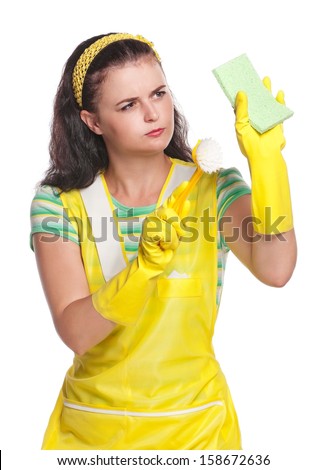 Young housewife with sponge and brush isolated on white background