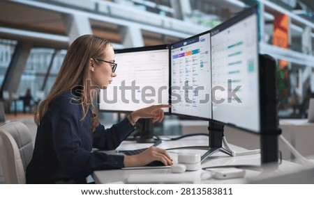 Young HR Manager Uses Computer Software To Analyze Employee Attendance Data.