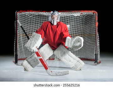 A Young Ice-hockey Goaltender In A Ready Position