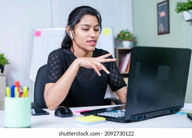Young India Businesswoman Convincing Client About Project On Video Call While Working At Office - Concept Of Business Skills, Woman Empowerment And Communication