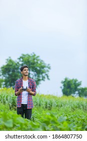 Young Indian Agronomist Operate Or Control Of Flying Drone At Agriculture Field