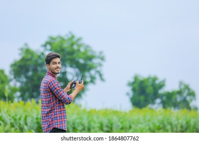 Young Indian Agronomist Operate Or Control Of Flying Drone At Agriculture Field