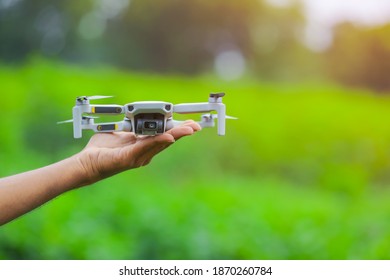 Young Indian Agronomist Operate Or Control Of Flying Drone At Agriculture Field