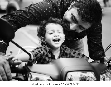 Young Indian Boy Riding A Motorbike