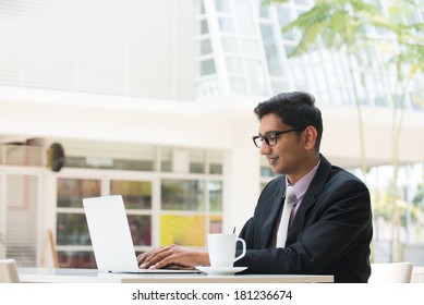 Young Indian Business Man On Laptop And Coffee