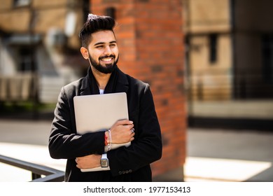 Young Indian Business Man Walking Outdoors Near Business Office