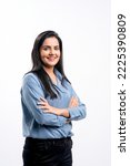 Young indian businesswoman or employee standing on white background.