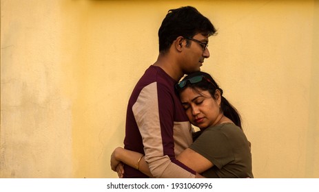 A young Indian couple hugging each other showing love. Selective focus.