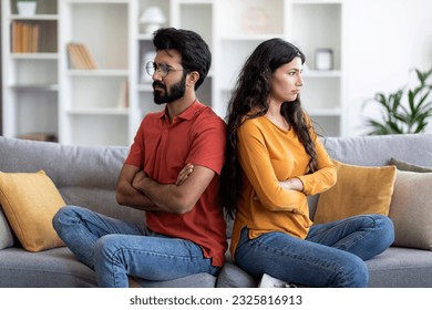 Young Indian Couple Sitting Back To Back On Couch At Home, Upset Eastern Man And Woman Offended After Domestic Quarrel, Suffering Family Conflicts And Problems In Relationship, Free Space - Shutterstock ID 2325816913