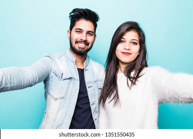 Young Indian Couple Take Selfie On Green Background