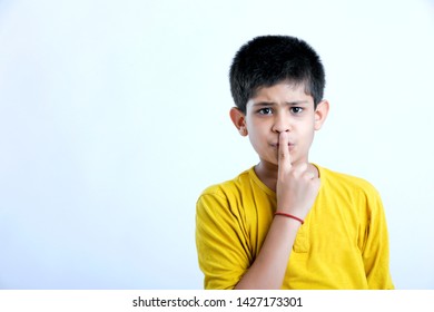 Young Indian  Cute Child Shush Expression
