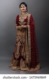 Young Indian Female Model In Bridal Wear And Bridal Jewelry