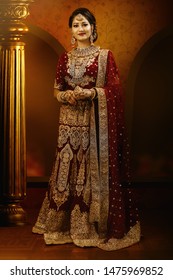 Young Indian female model in bridal wear and bridal jewelry
