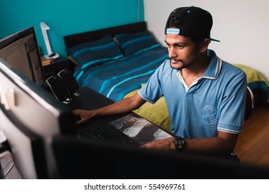 Young Indian Guy Using Computer