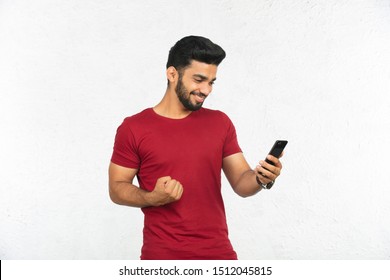 Young Indian Man Holding Phone Smiling Stock Photo 1512045815 ...