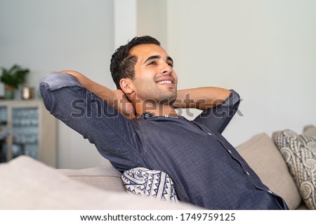 Image, Stock Photo Young man relaxing on the sofa with a laptop