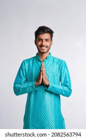 Young Indian Man In Traditional Wear And Giving Namaste Or Welcome Gesture