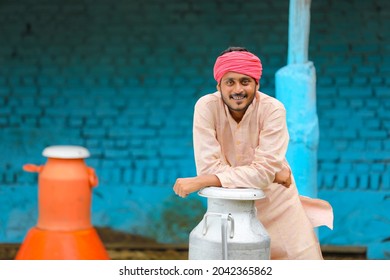 Young indian milk man at his farm