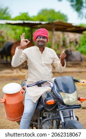 Young Indian Milk Man At His Dairy Farm.