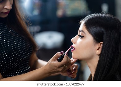 A Young Indian Model At A Beauty Salon, Makeup Artist Applying Lipstick On Customer.