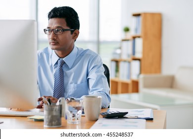 Young Indian Software Developer Working In Office