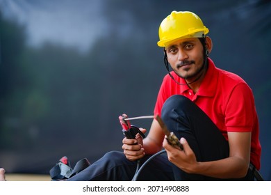 Young Indian Welder Working At Iron Factory