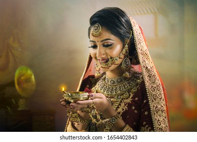 Young Indian Woman In Bridal Wear And Traditional Jewelry