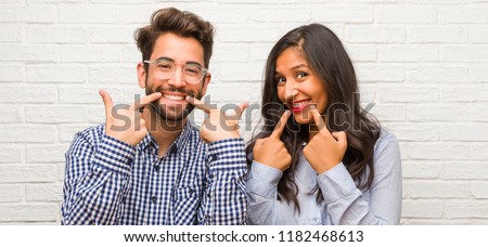 Similar – Image, Stock Photo Happy jovial healthy young woman posing between building in urban environment with sporty atmosphere