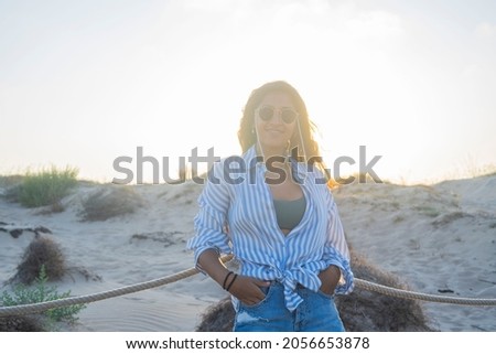 Young indian woman happy in the beach